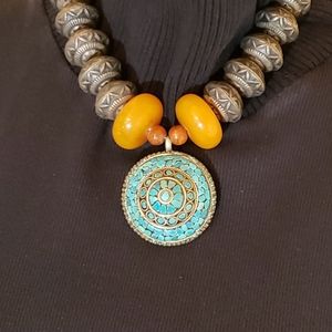 Turquoise inlay pendant on Amber and brass beads
